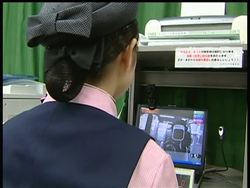 A Tokyo railway company introduces a smile scan for their personnel, hoping to improve their communication skills with their customers News Clip