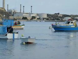 FISHING BOAT LEAVES HARBOUR Stock Footage