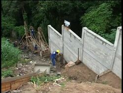 State government puts wall around shanty town to contain growth News Clip