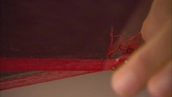 A woman weaves silk threads. Stock Footage