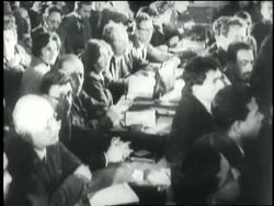 Judges sit behind tables at the Purge Trials in Russia. News Clip