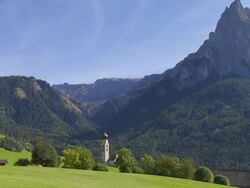 Old Church in Front of Mt. Schlern (South Tyrol) PAN Stock Footage
