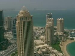 MS AERIAL PAN ZI View of skyscraper in city / Qatar Stock Footage