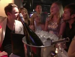 friends laughing and taking pics in nighclub lounge Stock Footage