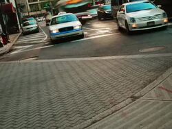 Time lapse, downtown street with buses, cars,  traffic, pedestrians, and buildings. Stock Footage