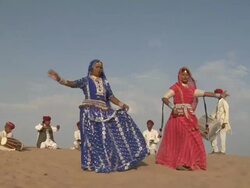 MS, Group of dancers and musicians wearing traditional clothing in Sam Desert, Jaisalmer, Rajasthan, India Stock Footage