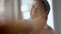 Pastry chef decorates gourmet cake with icing and chats with boss Stock Footage