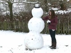 WS woman building snowman / Saarburg, Rhineland-Palatinate, Germany Stock Footage