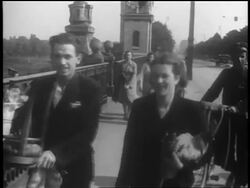 B/W 1939 people walking on bridge towards camera / Warsaw, Poland / documentary Stock Footage