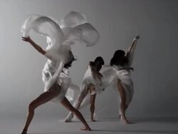 three woman dancers dancing draped with silk fabric Stock Footage