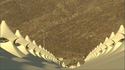 Peaks of the canopies of a tent pavilion stretch toward a hillside in Saudi Arabia. Stock Footage