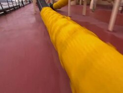 Pipes and tubing occupy the deck of a sludge barge. Stock Footage