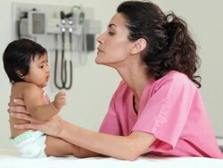 "hispanic medical worker with hispanic infant patient/Richmond,Virginia, USA " Stock Footage