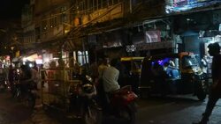 A pan view of the crowed streets of Old Delhi, outside the main entry gate of Jama Masjid just before dawn Stock Footage