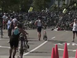 WS Triathletes with bicycles at transition area / Chicago, Illinois, USA Stock Footage