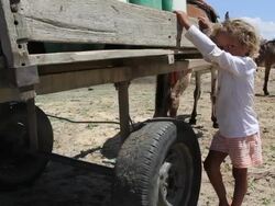 MS Shot of Family collecting water from shafts / Pilao Arcado, Bahia, Brazil Stock Footage