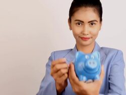Business woman with piggy bank Stock Footage