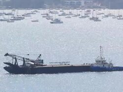 Fishing trawler sails into open sea Stock Footage