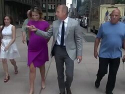 Savannah Guthrie and Matt Lauer talk about her pregnancy and Matt Lauer recognizes the reporter from TMZ while walking back to the TODAY show in Rockefeller Center Stock Footage