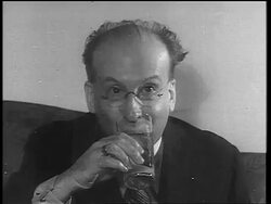 B/W 1933 close up sitting man with eyeglasses drinking from glass / end of Prohibition Stock Footage