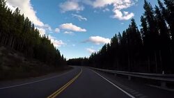 POV from car as it dives along mountain road Stock Footage