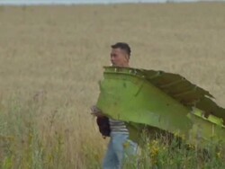 Malaysian air crash investigators at MH17 site News Clip