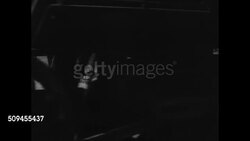 1920: U.S. TRAIN: LATE: EXT WS Horse at crossing, train passing FG. DRAMATIZATION: MS Old woman waiting at train station. LS Railroad tracks. MS Two men waiting at station checking pocket watch. Instructional Video
