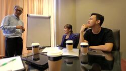 Startup Asian Business Entrepreneurs With Mentor in Meeting Stock Footage