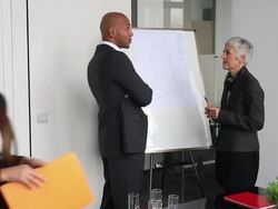 Team of architects going over blueprints Stock Footage