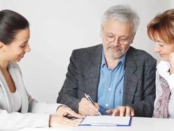Happy Mature Couple in Meeting With Financial Advisor Stock Footage