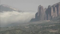 Fog Pouring Down Distant Valley  - Aerial View - Aragon, Huesca, Loscorrales, Spain Stock Footage