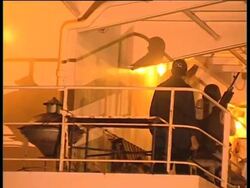 WRAP US ship attacked by pirates piloted into port; docking; Aerials ADDS crew News Clip