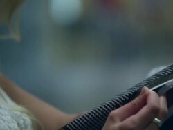 Up close slow motion of teenage girl flipping through magazine. Stock Footage