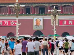 MS Shot of tourists in tiananmen square with mao zedong painting over entrance / Beijing, China Stock Footage