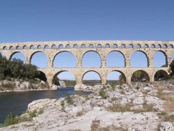 MS People walking on bridge / Vers-Pont-du-Gard, Provence ,France Stock Footage