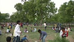 Families picnic at New Delhi monument News Clip