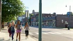 MS Group of women running on sidewalk of city street at sunrise Stock Footage