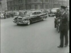 May 6, 1961 FILM MONTAGE WS Motorcade arriving at Admiralty House/ MS JFK Entering doorway/ MS Cars turning/ CU Jacqueline Kennedy/ London, England Stock Footage