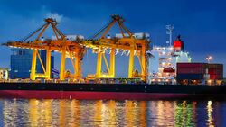 Cargo ship in the harbor at sunset . Stock Footage
