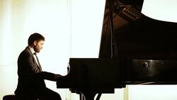 Man sitting on bench playing piano Stock Footage
