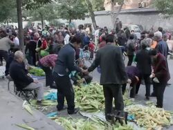 PAN WS Assortment of food and shoppers in street market/xian,shaanxi,China Stock Footage