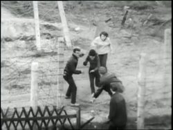 East Germans escape into West Berlin during the Cold War. News Clip