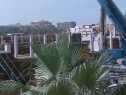 ZO heavy machinery carrying lumber in shipyard / Dubai, United Arab Emirates Stock Footage