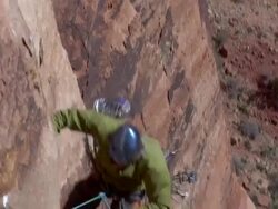 MS ZI PAN Climber falls of rock face and rope catches climber and climber screams  / Zion, UT, USA Stock Footage