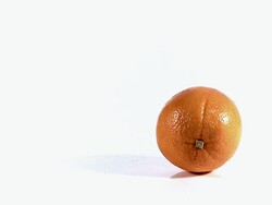 MS SLO MO Shot of rolling orange(citrus sinensis) / Vieux Pont, Normandy, France Stock Footage