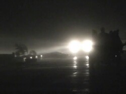People and tractor illuminated in fierce wind and rain, Philippines, Typhoon Parma, 2009 Stock Footage