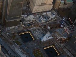 Aerial view of the 9/11 Memorial and New York City surroundings Stock Footage