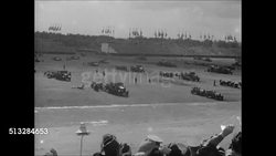 1936: NAZI RALLY, NURNBERG: Crowd in open bleachers looking up at aircraft flying overhead. MS Anti-Aircraft gunner firing. Three aircraft over field. XWS Military maneuvers on field in Nuremberg. Sailors, soldiers marching in formation, crowd. Instructional Video
