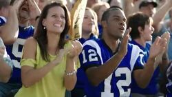 Stadium crowd cheers at football game Stock Footage