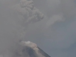 Ash shoots high into air from crater of erupting Mayon volcano, Philippines, Dec 2009 Stock Footage